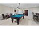 This game room features a pool table and a wet bar for easy entertainment at 216 Copper Beech Ct, Chapel Hill, NC 27517