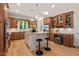 Beautiful kitchen with stainless appliances, custom cabinets, granite countertops, and an island, perfect for culinary enthusiasts at 216 Copper Beech Ct, Chapel Hill, NC 27517
