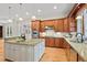 Gourmet kitchen boasting stainless steel appliances, granite countertops, and a large island with a sink at 216 Copper Beech Ct, Chapel Hill, NC 27517