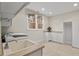 Functional laundry room featuring white cabinets, sink and window allowing natural light at 216 Copper Beech Ct, Chapel Hill, NC 27517