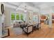 Living room with coffered ceilings, large windows overlooking the yard, and a fireplace at 216 Copper Beech Ct, Chapel Hill, NC 27517