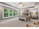 Spacious main bedroom with a tray ceiling, large windows, and neutral tones, offering a serene retreat at 216 Copper Beech Ct, Chapel Hill, NC 27517
