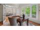 Office space with ample natural light, french doors, and views to the dining room at 216 Copper Beech Ct, Chapel Hill, NC 27517