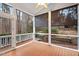 Screened porch with views of the backyard, offering a peaceful outdoor living space at 216 Copper Beech Ct, Chapel Hill, NC 27517