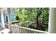 This porch offers a view of the lush greenery and foliage surrounding the home at 216 Copper Beech Ct, Chapel Hill, NC 27517