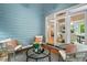 Inviting screened porch with comfortable seating provides a relaxing outdoor space, perfect for enjoying the surrounding natural beauty at 216 Copper Beech Ct, Chapel Hill, NC 27517