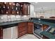 This wet bar features generous cabinets, counter space, and appliances, including a wine chiller at 216 Copper Beech Ct, Chapel Hill, NC 27517