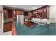 A sophisticated wet bar with beautiful wood cabinets, stainless appliances, and granite countertops at 216 Copper Beech Ct, Chapel Hill, NC 27517