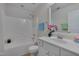 Bright bathroom with a shower-tub combo, vanity with mirror, and stylish decor at 222 Grey Elm Trl, Durham, NC 27713