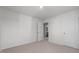 Bedroom featuring neutral carpet, white walls, and access to an adjacent bathroom at 258 Palm Dr, Sanford, NC 27332