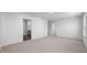 Expansive living room with neutral carpet, and multiple doorways at 258 Palm Dr, Sanford, NC 27332