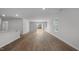 Bright living room boasting wood-look flooring, sliding glass doors, and neutral walls at 258 Palm Dr, Sanford, NC 27332