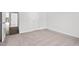 Cozy bedroom featuring neutral carpet and a door leading to the hall at 260 Logan Creek Dr, Zebulon, NC 27597
