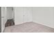 Comfortable bedroom featuring neutral carpet and a door leading to the next room at 260 Logan Creek Dr, Zebulon, NC 27597