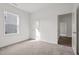 Inviting bedroom featuring neutral carpet and a door leading to the next room at 260 Logan Creek Dr, Zebulon, NC 27597