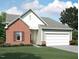 Charming single-Gathering home featuring a brick facade, attached garage, and well-maintained landscaping at 260 Logan Creek Dr, Zebulon, NC 27597