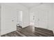Open entryway featuring wood-look flooring, white doors, and access to the bathroom at 260 Logan Creek Dr, Zebulon, NC 27597