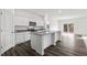 Modern kitchen features white cabinets, granite countertops, and a stylish island at 260 Logan Creek Dr, Zebulon, NC 27597