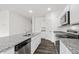 Spacious kitchen featuring granite counters and stainless steel dishwasher at 260 Logan Creek Dr, Zebulon, NC 27597