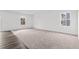 Bright living room with plush carpet, neutral walls, and natural light from windows at 260 Logan Creek Dr, Zebulon, NC 27597
