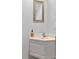 Compact bathroom with a corner sink, chrome faucet, and neutral-colored walls at 28 W Madison, Pittsboro, NC 27312
