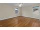 Spacious bedroom featuring hardwood floors, neutral walls, and a ceiling fan at 28 W Madison, Pittsboro, NC 27312