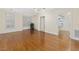 Spacious bedroom with hardwood floors, large windows with shutters, and walk-in closet at 28 W Madison, Pittsboro, NC 27312