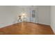Bedroom with hardwood floors, neutral walls, and a seating area next to the window at 28 W Madison, Pittsboro, NC 27312