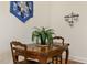 Cozy dining area with wood table and chairs, great natural light and charming wall decor at 28 W Madison, Pittsboro, NC 27312