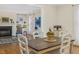 Elegant dining room with hardwood floors, bright natural light and a decorative centerpiece at 28 W Madison, Pittsboro, NC 27312