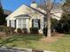 Charming single-story home with manicured lawn and mature landscaping at 28 W Madison, Pittsboro, NC 27312