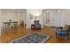 Open-concept living area with hardwood floors, classic seating, and bright natural light at 28 W Madison, Pittsboro, NC 27312