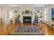 Living room with built-in shelving, fireplace, and elegant seating area at 28 W Madison, Pittsboro, NC 27312
