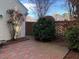 Brick patio featuring landscaped yard and a brick wall for added privacy at 28 W Madison, Pittsboro, NC 27312