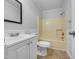 Bathroom includes a shower, toilet, vanity with sink, mirror and updated fixtures at 2836 Thurrock Dr, Apex, NC 27539