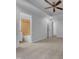Spacious primary bedroom has neutral walls, carpet, ceiling fan and an en suite bath at 2836 Thurrock Dr, Apex, NC 27539