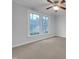 Bright bedroom featuring a double window and a ceiling fan with light fixture at 2836 Thurrock Dr, Apex, NC 27539