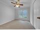 Bedroom features a ceiling fan and a double window allowing natural light at 2836 Thurrock Dr, Apex, NC 27539