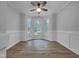 Dining room featuring new flooring, bay windows, and crown molding at 2836 Thurrock Dr, Apex, NC 27539