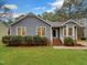 Charming single-story home featuring a well-manicured lawn and inviting front porch at 2836 Thurrock Dr, Apex, NC 27539