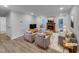 Bright living room with hardwood floors, fireplace, and ample seating at 2836 Thurrock Dr, Apex, NC 27539