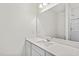 Bathroom with quartz counters, a vanity and a glass enclosed shower at 312 Arch Canyon Cir, Zebulon, NC 27597