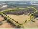 Aerial view of a large lot featuring established trees and some fields at 4051 Silk Hope Gum Springs Rd, Pittsboro, NC 27312