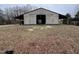 Exterior view of open barn, highlighting its spacious interior and potential for storage or livestock at 4051 Silk Hope Gum Springs Rd, Pittsboro, NC 27312
