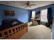 Comfortable bedroom with carpeted floor, ceiling fan, and natural light at 4051 Silk Hope Gum Springs Rd, Pittsboro, NC 27312