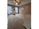 Bedroom with a ceiling fan, carpet, and two windows with white curtains at 4051 Silk Hope Gum Springs Rd, Pittsboro, NC 27312