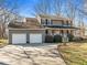Two-story home features a large front porch and a two-car garage at 4051 Silk Hope Gum Springs Rd, Pittsboro, NC 27312