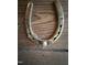 Close-up of brass horseshoe at 4051 Silk Hope Gum Springs Rd, Pittsboro, NC 27312