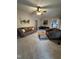 Spacious living room with carpet, comfortable seating, and natural light at 4051 Silk Hope Gum Springs Rd, Pittsboro, NC 27312
