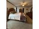 Inviting main bedroom with a ceiling fan, carpeted floor, and lots of storage at 4051 Silk Hope Gum Springs Rd, Pittsboro, NC 27312